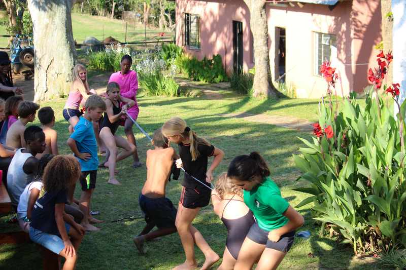 Youth Adventure Kids Camps children outdoor learning explore eswatini team activities - tug of war fun & games